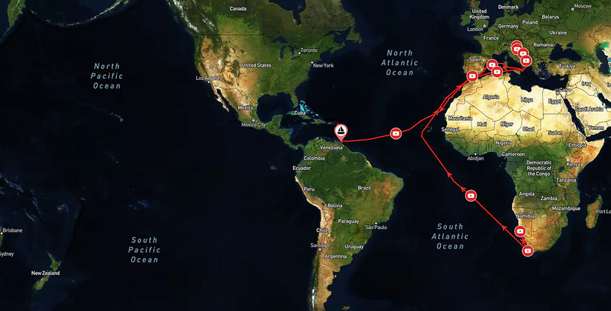 Map of a sailing route in the Atlantic, indicated by red lines and icons, covering parts of Europe, Africa, and the Americas.