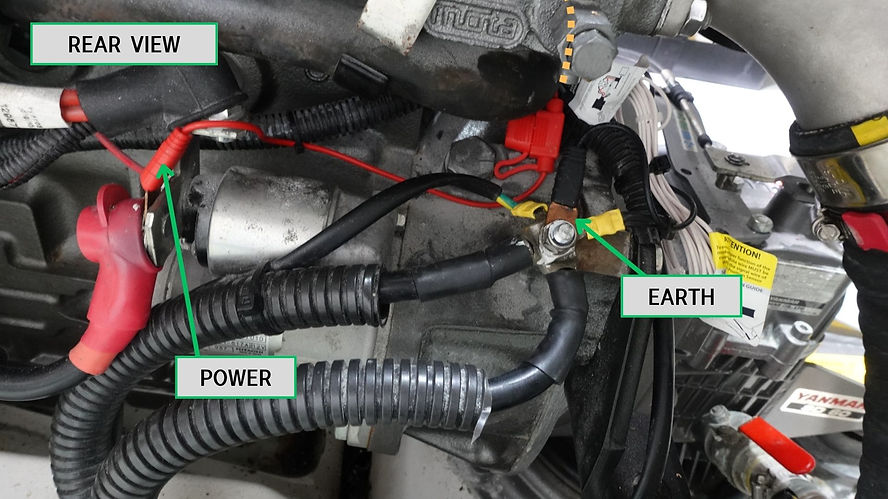 Rear view of marine engine power and earth connections