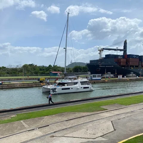 Yacht transit up the Panama Canal on a sunny day