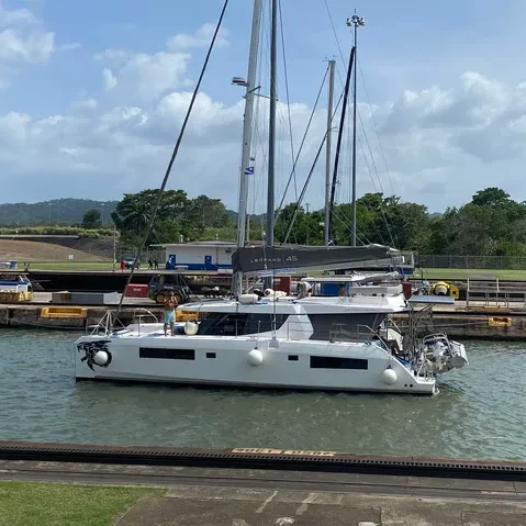 Yacht transit up the Panama Canal on a sunny day